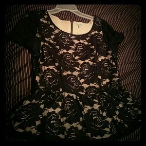 Black lace blouse with cream underlining.